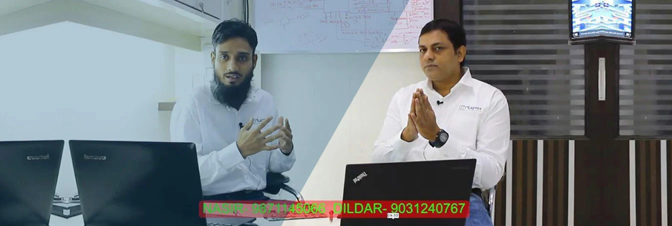 Laptex trainers explaining laptop repair concepts with real laptops